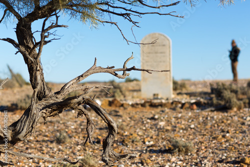 Old headstone in abandoned cemetery