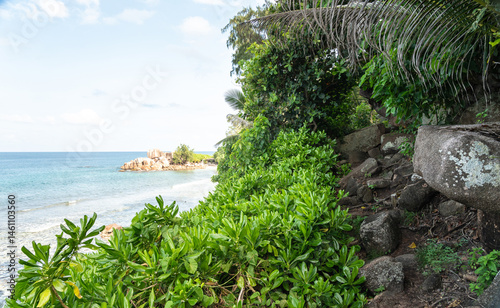 Challenging hiking trail along the ocean coast on La Digue Island, Seychelles