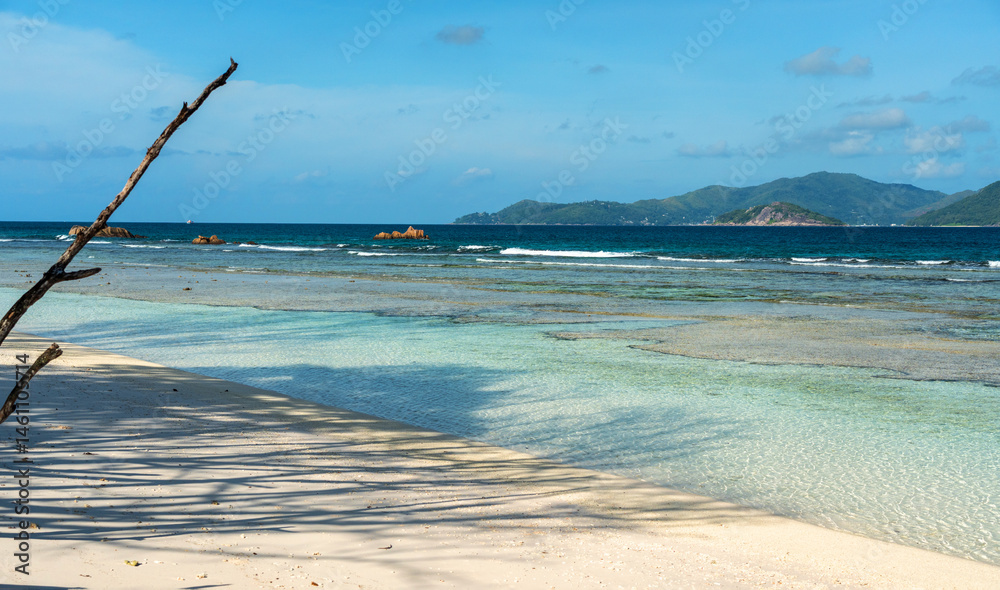 Anse Severe beach on La Digue island offers crystal clear waters, white sand
