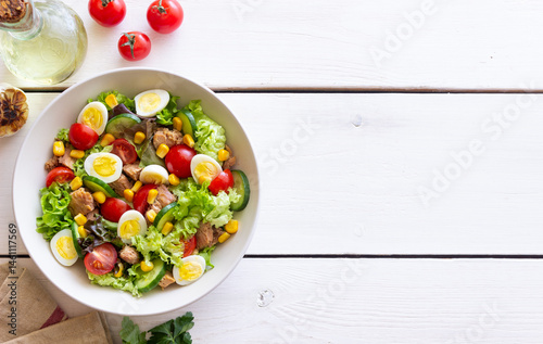 Salad with tuna, eggs, tomatoes, cucumbers and corn. Healthy eating. Diet.