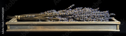 Obraz na płótnie Dried lavender bundle on a rustic wooden tray, black background. w salonie