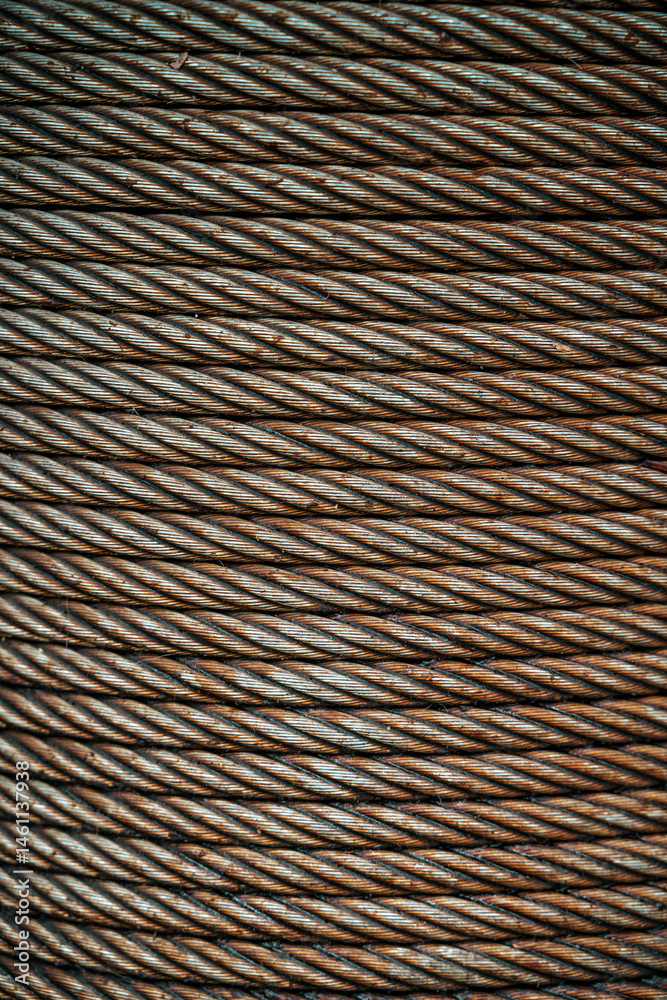 Rusty metal rope in a reel texture background Rusty metal rope in a reel texture background