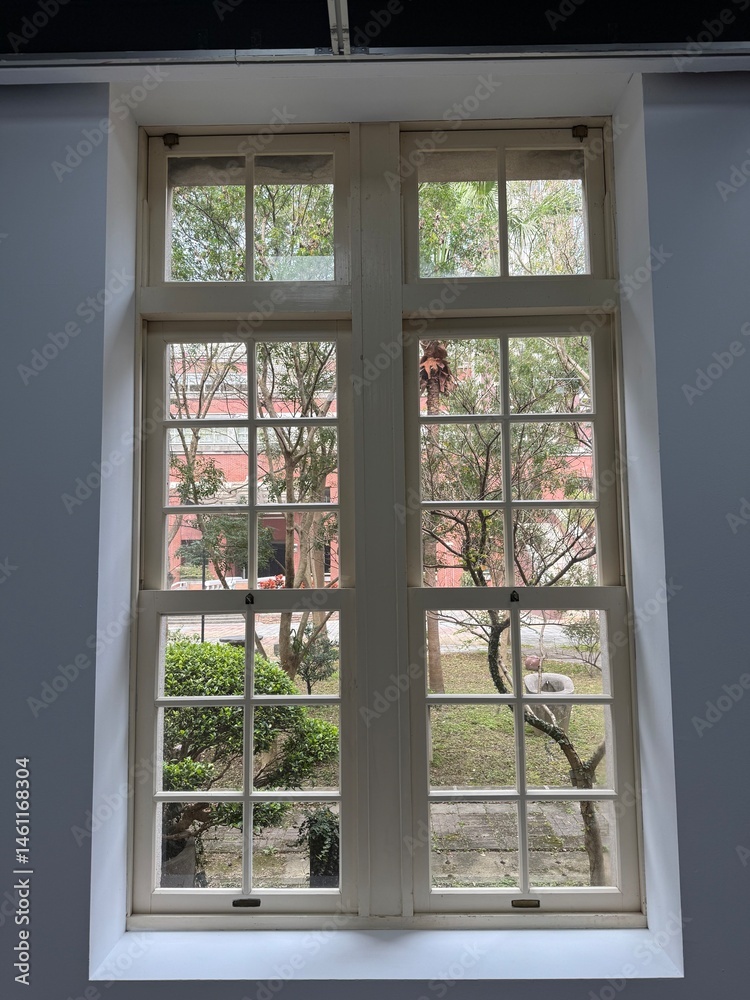 Obraz premium Garden views from the window in the old house