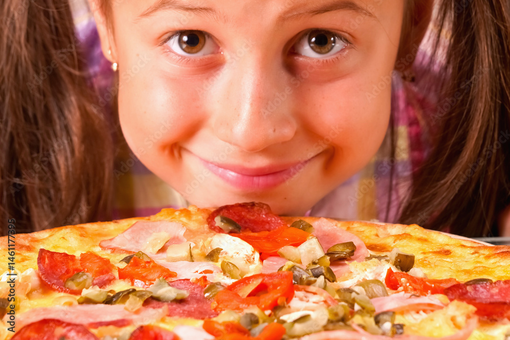 Funny portrait of happy young girl with pizza.