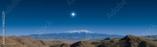 Celestial Heights: A breathtaking landscape showcasing a majestic snow-capped mountain range under a brilliant star in a clear, cerulean sky. A harmonious blend of earth and sky.