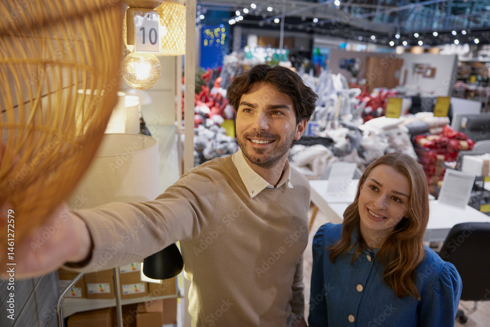 A couple enjoying a shopping experience for modern home decor in a stylish store