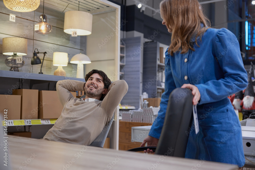Couple relax in stylish office furniture showroom showcasing modern designs