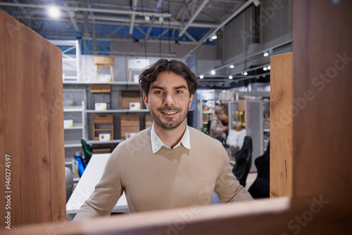 Obraz na płótnie Man stands confidently with bright smile embodying success in modern, contemporary work environment w salonie