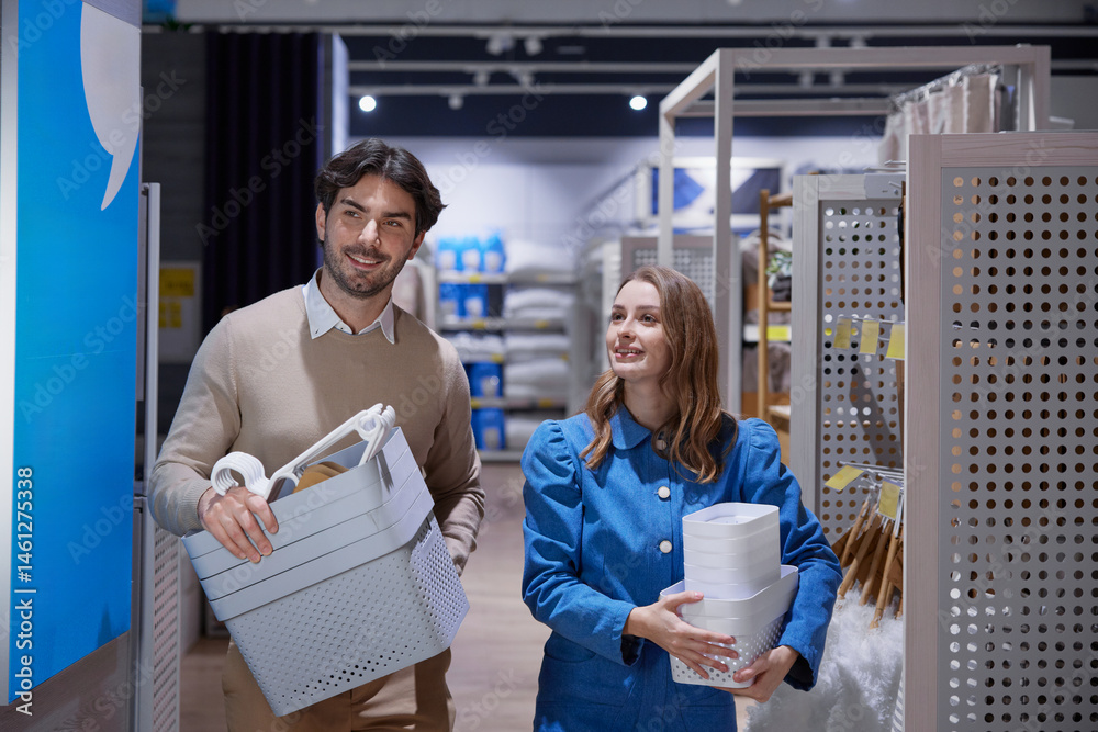 Couple happily enjoys shopping together, carrying their colorful items in a vibrant and modern store