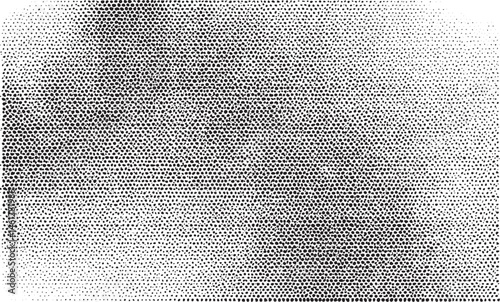 A textured black and white displays a dense of small dots creating an abstract background.