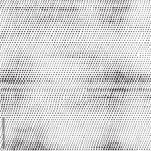 A dense of black and white dots creates a subtle face-like illusion.