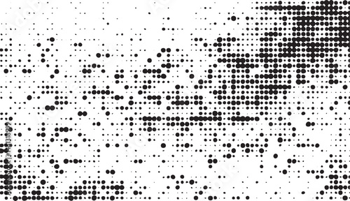A monochrome displays a dense of closely spaced black dots transitioning to white.