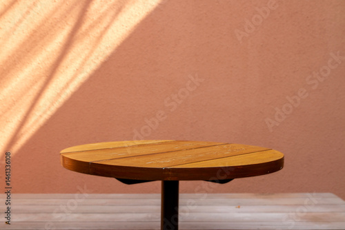 wooden tabletop with warm wall background. perfect for product display amd mockup