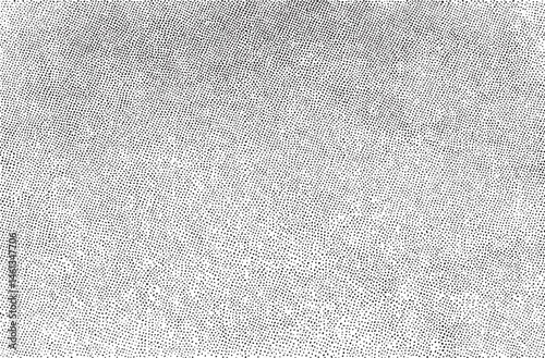 A textured surface displays a dense of small evenly spaced dots.