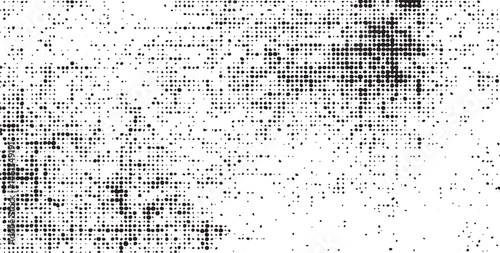 A dense array of small white dots gradually transitions into a darker gray background.