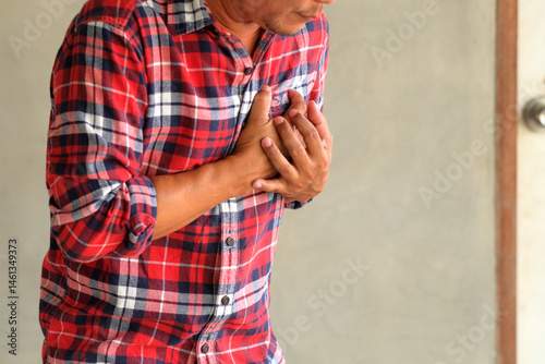 A middle-aged man felt severe chest pain. heart attack caused by stress, heart disease, Human pain