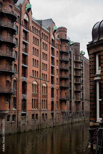 Historic brick buildings and steel bridges over water in Hamburg