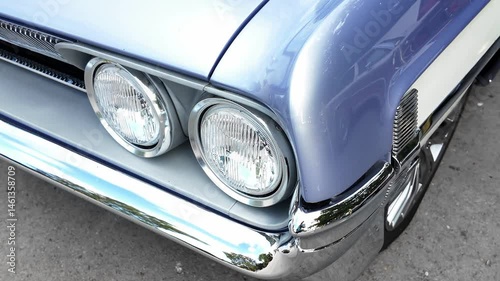 Close-Up of Classic Vintage Car Front with Dual Headlights and Chrome Bumper. Retro Automotive Detail for Restoration, Nostalgia, or Collector Themes