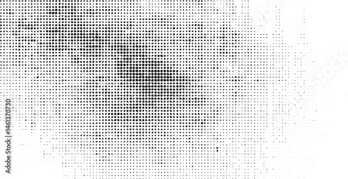 A blurred textured portrait reveals a human face through a dense of dots.
