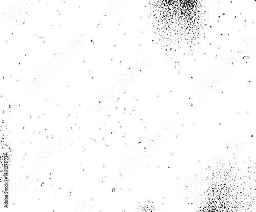 A scattering of small dark dots covers a white background.