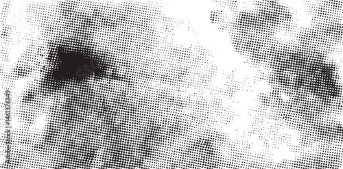 A grayscale portrait reveals a blurred human face with textured speckled