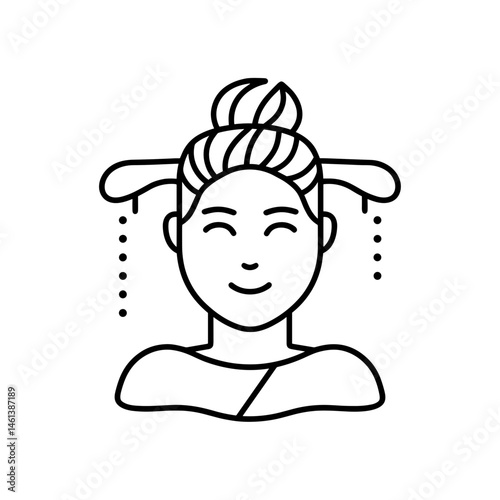 Happy woman enjoying a spa treatment with hair wrapped