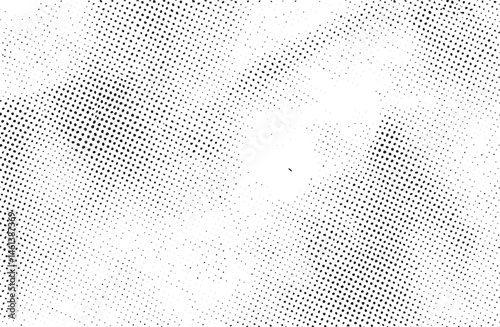 A dense repeating of white dots covers a black background creating an abstract visual texture.