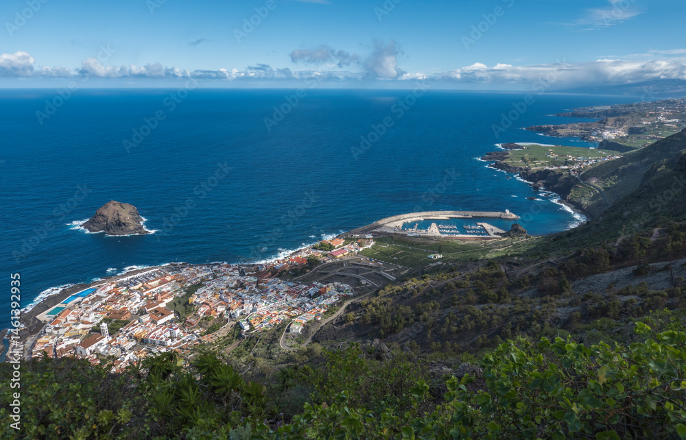 Aerial view of old town Garachico from Mirador de Garachico view point. Colorful houses and harbor. Ocean shore with lava rock pools. Popular tourist destination, Tenerife Canary Islands. Aerial view of old town Garachico from Mirador de Garachico view point. Colorful houses and harbor. Ocean shore with lava rock pools. Popular tourist destination, Tenerife Canary Islands.