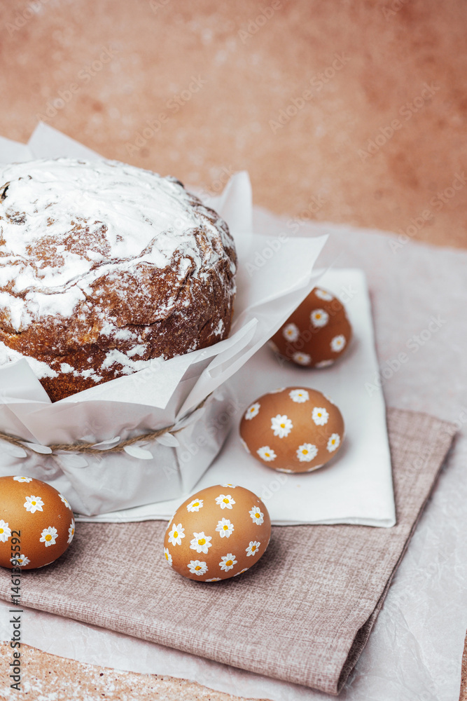 Traditional Easter cake with hand-painted daisy eggs on fabric. Homemade festive baked goods and decor...
