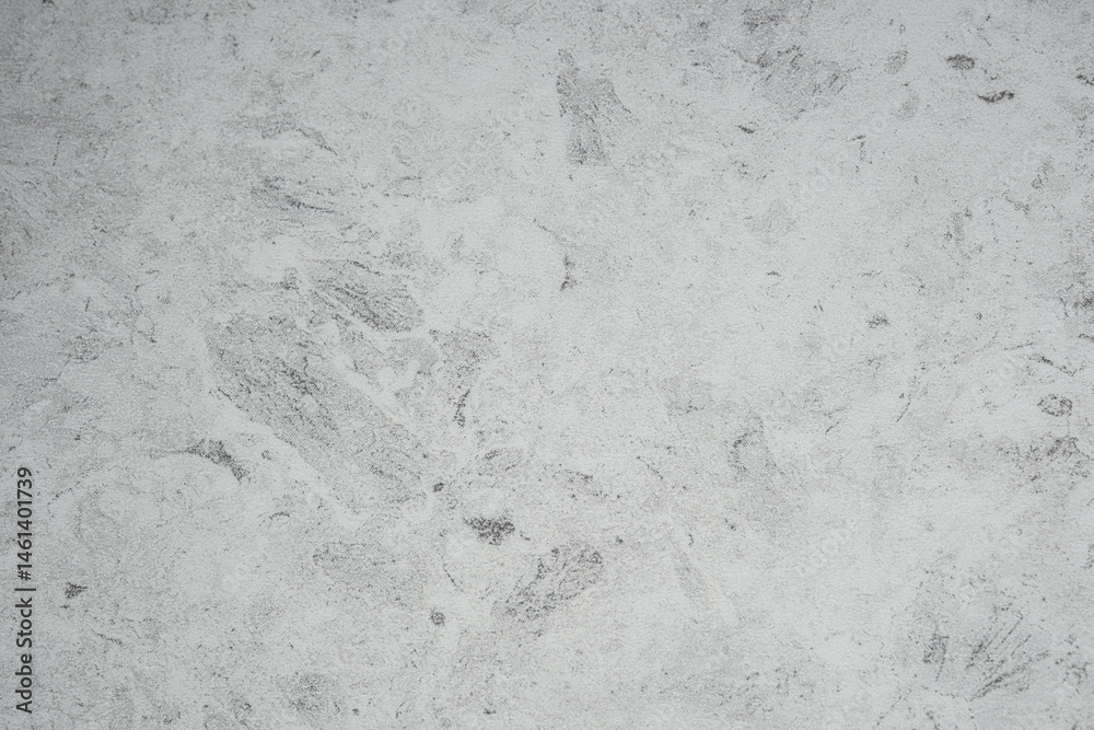 Textured gray surface with subtle patterns creates a calming atmosphere
