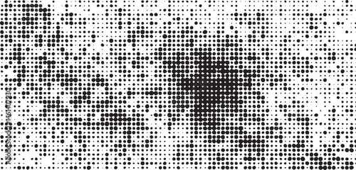A dense of small scattered white and black dots creates a textured surface.