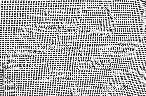 A dense of numerous black dots creates a textured surface against a dark background.