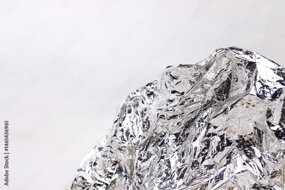 Abstract white foil texture resembling mountain peaks, set against a clean background. A creative and modern design element ideal for minimalistic compositions, product packaging, abstract projects