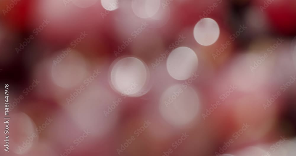 Abstract bokeh image featuring pink and red hues. Blurred circles of light create a dreamy and soft atmosphere, perfect for festive and romantic themes. Abstract Pink And Red Bokeh Background