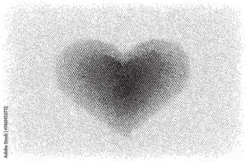 A grayscale heart shape emerges from a dense field of tiny dots.