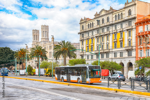 Fototapeta Naklejka Na Ścianę i Meble -  Street with typical architecture of the old center of Cagliari and Town Hall, Municipio di Cagliari.