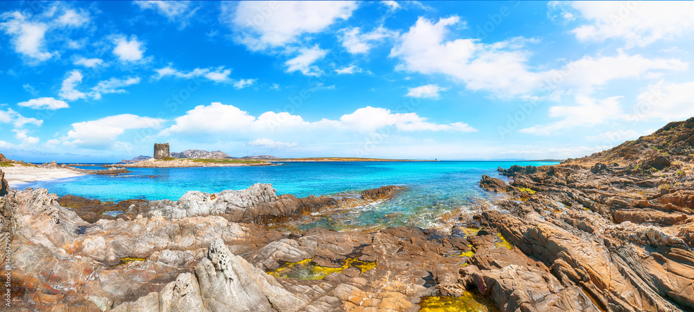 Unbelivable morning view of famous La Pelosa beach and rocky shore near Torre della Pelosa