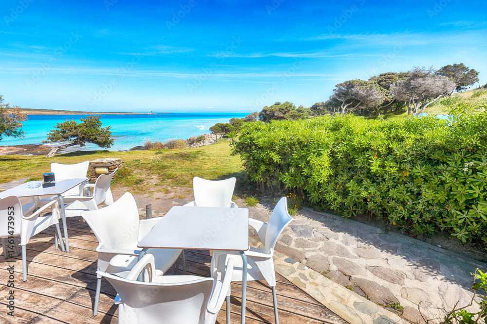 Unbelivable Beach restaurant on Famous La Pelosa beach on sunny summer day.