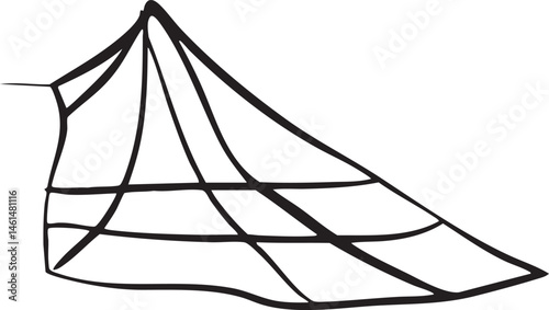 A single dark sailboat's sail billows dramatically in a strong wind.