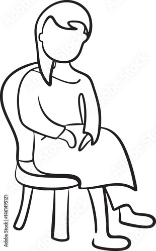 A woman sits quietly in a chair lost in thought.