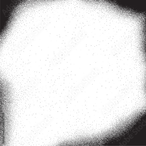 A soft circular white shape is surrounded by a dense scattering of small black dots.