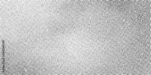 A stark monochrome displays a dense of white dots against a dark background.