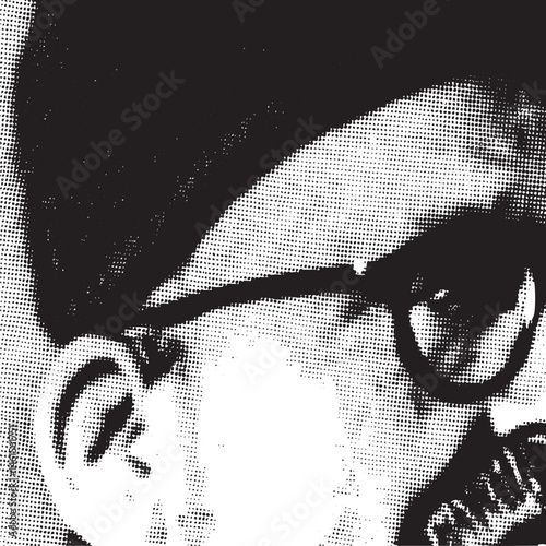 A grayscale portrait of a person wearing glasses.