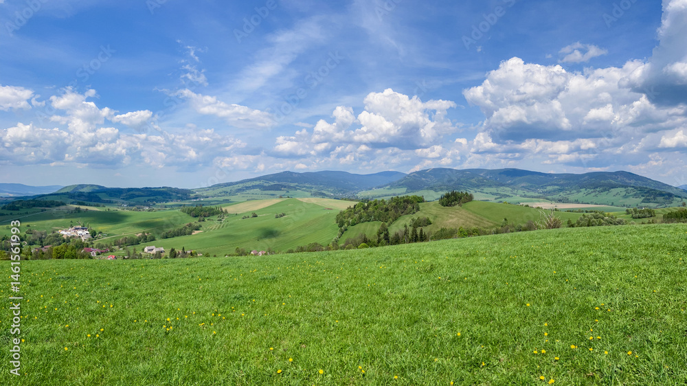 Naklejka premium Aerial view of the Czech landscape with mountains and forests at sunset. Scenic spring evening over the Orlicke Mountains,, and Dolni Morava region