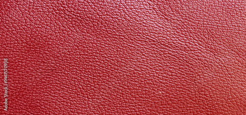 Red color leather texture background for copy space. Skin pattern for manufacturing of luxury shoes, clothes, bags and fashion.
