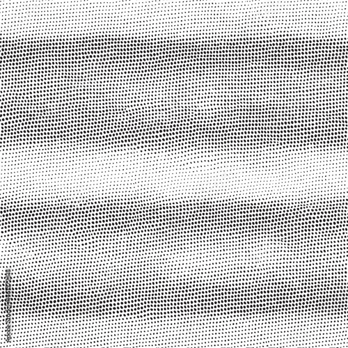 A seamless of densely packed black and white dots forms a gradient effect.