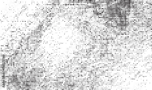 A dense textured of white dots against a black background creates an abstract visual effect.
