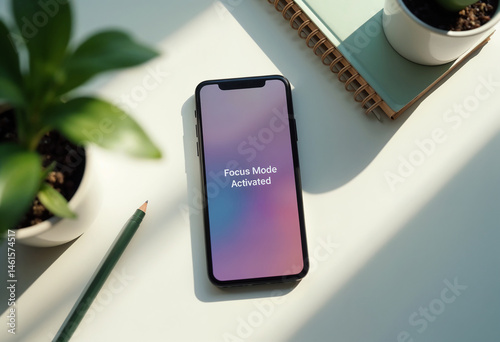 Minimalist workspace with phone displaying 