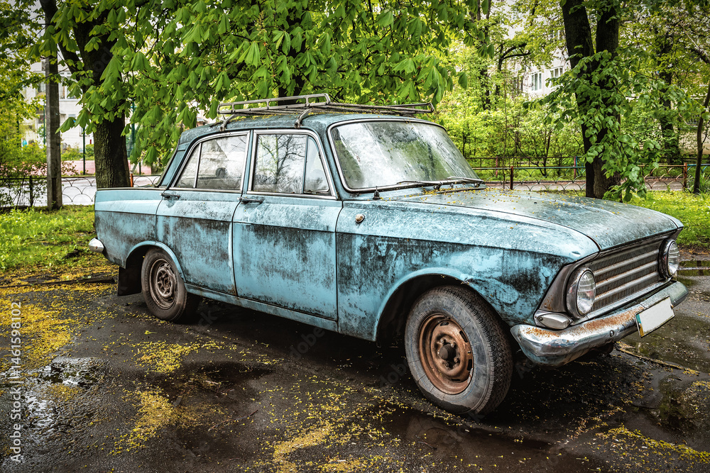 Old retro abandoned car under the rain Old retro abandoned car under the rain
