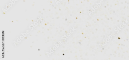 Sparkling gold glitter scattered on a clean white backdrop. Perfect for backgrounds, textures, and festive designs.